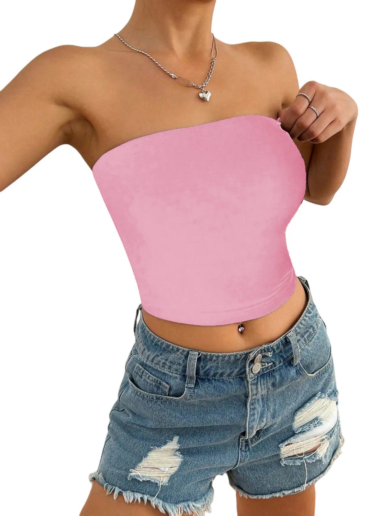 Un top féminin et moderne qui épouse parfaitement la silhouette. Sa coupe slim et sa teinte rose douce créent un look minimaliste mais résolument chic, idéal pour composer des tenues estivales élégantes et street - fashion. - Deliora